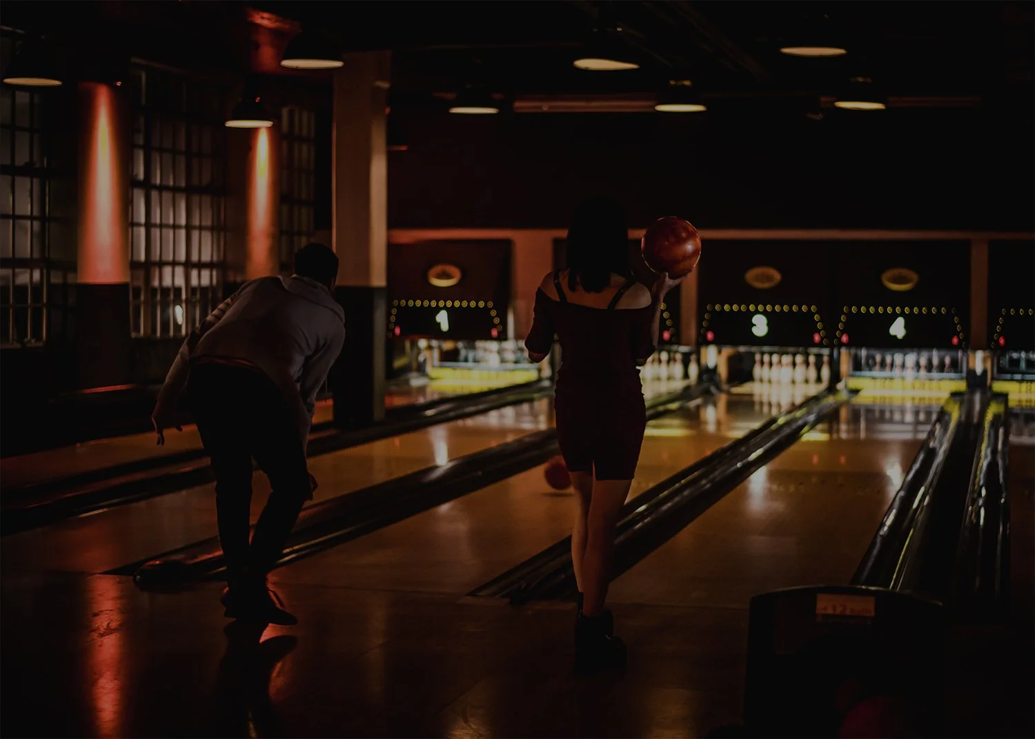 Bowlers under the warm lights of The Lanes